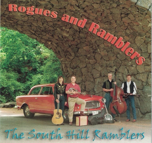 Rogue and Ramblers album cover image. Band members standing with their musical instruments around a classic car.