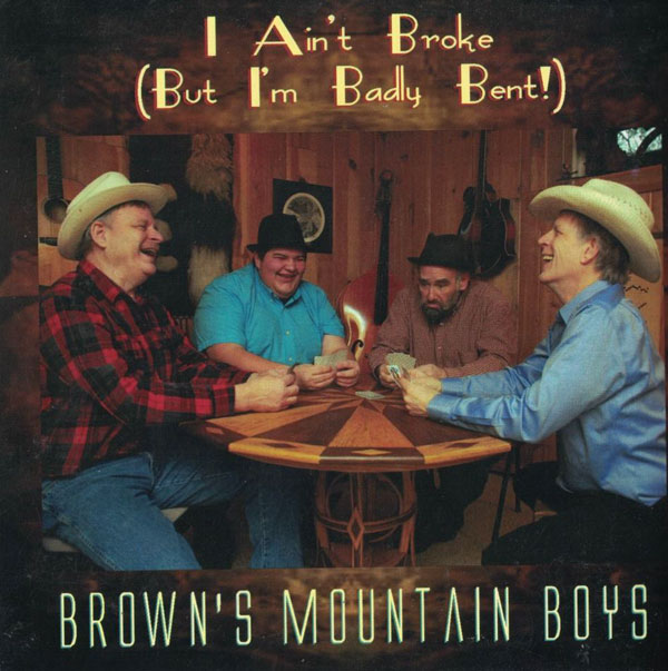 Album cover for I ain't Broke, But I'm Badly Bent. Artists sitting at table playing cards.